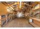 Interior of garage featuring walls with insulation, concrete flooring, shelving, and overhead lighting at 4416 Tevalo Dr, Valrico, FL 33596