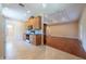 Open-concept kitchen with light wood cabinets and stainless steel appliances at 4416 Tevalo Dr, Valrico, FL 33596