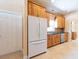 Bright kitchen featuring wood cabinets, black countertops, and tile flooring at 4416 Tevalo Dr, Valrico, FL 33596