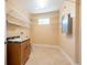 Laundry room with sink and wire shelving at 4416 Tevalo Dr, Valrico, FL 33596