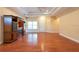 Large living room features hardwood floors, tray ceiling, and plenty of natural light at 4416 Tevalo Dr, Valrico, FL 33596