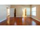 Spacious main bedroom with hardwood floors with access to bathroom and closet at 4416 Tevalo Dr, Valrico, FL 33596