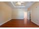 Spacious main bedroom with hardwood floors and a tray ceiling at 4416 Tevalo Dr, Valrico, FL 33596