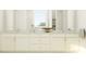 Elegant bathroom with dual sinks, white cabinetry, quartz countertops, and modern fixtures for a spa-like experience at 4470 Southern Valley Loop, Brooksville, FL 34601