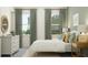Comfortable bedroom with natural light, two windows, a dresser, and serene decor elements at 4470 Southern Valley Loop, Brooksville, FL 34601