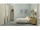 Inviting bedroom with a comfortable bed, decorative artwork, and convenient closet space for optimal storage at 4470 Southern Valley Loop, Brooksville, FL 34601