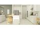 Modern kitchen with white cabinets, stainless steel appliances, and a center island with seating at 4470 Southern Valley Loop, Brooksville, FL 34601