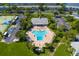 Aerial view of community pool, tennis courts and clubhouse area at 4816 Snook Se Dr # F, St Petersburg, FL 33705