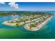 Breathtaking aerial view of waterfront condos surrounded by lush landscaping and tranquil water at 4816 Snook Se Dr # F, St Petersburg, FL 33705