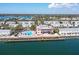 Aerial view of resort amenities with a swimming pool, clubhouse, and waterfront access at 4816 Snook Se Dr # F, St Petersburg, FL 33705