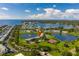 Scenic aerial view of condo buildings near a lake, showcasing serene community setting at 4816 Snook Se Dr # F, St Petersburg, FL 33705