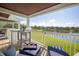 Inviting balcony view with comfortable seating and a beautiful lake view at 4816 Snook Se Dr # F, St Petersburg, FL 33705