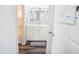 Bright bathroom vanity featuring modern fixtures, shelves, and a peek into the shower/tub at 4816 Snook Se Dr # F, St Petersburg, FL 33705