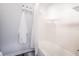 Clean white bathtub with bright tile and modern fixtures in renovated bathroom at 4816 Snook Se Dr # F, St Petersburg, FL 33705