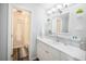 Bright and airy bathroom with white vanity, modern lighting, and decorative accents at 4816 Snook Se Dr # F, St Petersburg, FL 33705