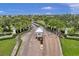Gated community entrance surrounded by lush greenery, enhancing privacy and curb appeal at 4816 Snook Se Dr # F, St Petersburg, FL 33705