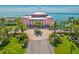 Luxury waterfront property with a grand entrance, lush landscaping, and stunning water views at 4816 Snook Se Dr # F, St Petersburg, FL 33705