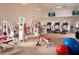 Well-equipped fitness center with a variety of machines and free weights, promoting a healthy lifestyle in the community at 4816 Snook Se Dr # F, St Petersburg, FL 33705