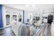 Open concept living room with French doors leading to beautiful lake view at 4816 Snook Se Dr # F, St Petersburg, FL 33705