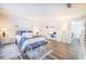 Spacious main bedroom featuring a stylish work area, wood-look flooring, and plenty of natural light at 4816 Snook Se Dr # F, St Petersburg, FL 33705