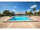 Resort-style swimming pool with large brick patio, surrounded by lush landscaping at 4816 Snook Se Dr # F, St Petersburg, FL 33705