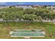 Aerial view of shuffleboard courts surrounded by mature trees for outdoor entertainment and recreation at 4816 Snook Se Dr # F, St Petersburg, FL 33705