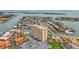 Aerial view of a condominium complex featuring a marina, swimming pool, and expansive water views at 4900 Brittany S Dr # 211, St Petersburg, FL 33715