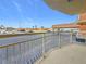 Balcony overlooking the parking lot and building in the distance at 4900 Brittany S Dr # 211, St Petersburg, FL 33715