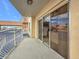 Balcony with railing offers exterior views; sliding glass doors provide indoor-outdoor flow at 4900 Brittany S Dr # 211, St Petersburg, FL 33715