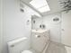 Bathroom featuring a vanity with sink, lighting, and fixtures, creating a clean aesthetic at 4900 Brittany S Dr # 211, St Petersburg, FL 33715