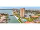 Aerial view of a condo building with a marina, swimming pool, landscaping, and bridge at 4900 Brittany S Dr # 211, St Petersburg, FL 33715