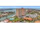 Aerial view of a high-rise condominium community with marina and pool at 4900 Brittany S Dr # 211, St Petersburg, FL 33715