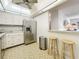 Bright kitchen features stainless steel appliances and counter seating at 4900 Brittany S Dr # 211, St Petersburg, FL 33715