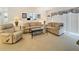 Inviting living room with comfortable seating, bright light, and neutral decor at 4900 Brittany S Dr # 211, St Petersburg, FL 33715