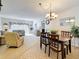 Open living and dining area with tile flooring and neutral decor at 4900 Brittany S Dr # 211, St Petersburg, FL 33715