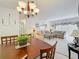 Comfortable living room with neutral tones and modern chandelier lighting at 4900 Brittany S Dr # 211, St Petersburg, FL 33715