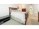Serene bedroom with a wooden-framed bed, white comforter, and access to an ensuite bathroom, offering comfort and privacy at 4900 Brittany S Dr # 211, St Petersburg, FL 33715