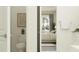 Bathroom leading to bedroom, featuring a toilet, vanity, and view of a cozy bedroom with a striped bedspread at 4923 Southern Valley Loop, Brooksville, FL 34601