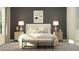 Stylish bedroom with a modern bed, abstract art, and elegant lamps on matching nightstands at 4923 Southern Valley Loop, Brooksville, FL 34601
