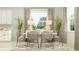 Bright dining room featuring a modern table set, large window, neutral color palette, and stylish decor at 4923 Southern Valley Loop, Brooksville, FL 34601