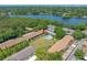 An aerial view of the condo community, showcasing its proximity to the lake and community pool at 4991 Puritan Cir # 522, Tampa, FL 33617