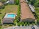 Community aerial view featuring a refreshing pool, lush landscaping, and convenient parking at 4991 Puritan Cir # 522, Tampa, FL 33617