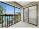 The balcony features in-unit laundry hookups and sliding glass doors leading to the community pool area at 4991 Puritan Cir # 522, Tampa, FL 33617