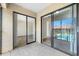 Tiled patio featuring a view into the living area and the community pool and lounge area at 4991 Puritan Cir # 522, Tampa, FL 33617