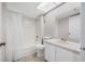 Bathroom with tiled floor, shower and tub combo and vanity at 4991 Puritan Cir # 522, Tampa, FL 33617