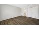 Bright bedroom featuring wood-look flooring, a bathroom, and a closet at 4991 Puritan Cir # 522, Tampa, FL 33617