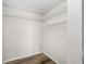 Walk-in closet with ample shelving and wood look floors at 4991 Puritan Cir # 522, Tampa, FL 33617