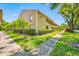 Condo building exterior with well-maintained landscaping and sidewalks, offering a serene environment at 4991 Puritan Cir # 522, Tampa, FL 33617