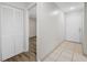 Hallway with closet and a view of a bedroom, showcasing flooring and layout at 4991 Puritan Cir # 522, Tampa, FL 33617