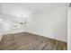Bright living room featuring wood floors and contemporary lighting fixture at 4991 Puritan Cir # 522, Tampa, FL 33617